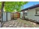 Charming backyard featuring a storage shed, wooden fence, and quaint seating area perfect for outdoor relaxation at 2955 N Gilpin St, Denver, CO 80205