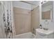 Tiled bathroom with neutral tones, tub and shower combination, and modern sink and vanity at 2955 N Gilpin St, Denver, CO 80205