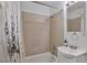 Bathroom featuring a bathtub with shower, tiled walls, vanity sink, and modern fixtures at 2955 N Gilpin St, Denver, CO 80205
