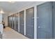 Image of the hallway with several entry doors each painted with matching blue-grey paint at 2955 N Gilpin St, Denver, CO 80205