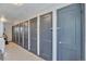 Hallway with multiple closet doors, providing ample storage space, and tile floor at 2955 N Gilpin St, Denver, CO 80205