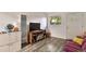 Comfortable living room with hardwood floors, a TV, and an entrance door at 2955 N Gilpin St, Denver, CO 80205