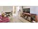 Open-concept room with hardwood floors adjacent to the kitchen and dinning area at 2955 N Gilpin St, Denver, CO 80205