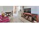 Cozy living room featuring wood floors, a decorative shelf, and an open view into the kitchen area at 2955 N Gilpin St, Denver, CO 80205