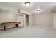 Spacious finished basement with carpeting and neutral paint, ready for recreation and relaxation at 9564 Cordova Dr, Highlands Ranch, CO 80130