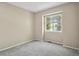 Neutral bedroom with a gray carpet, a window and natural light at 9564 Cordova Dr, Highlands Ranch, CO 80130