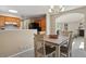 Open dining area connecting to the kitchen and living room, with view of the backyard at 9564 Cordova Dr, Highlands Ranch, CO 80130