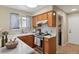 Functional kitchen features wooden cabinets, modern appliances, and ample counter space at 9564 Cordova Dr, Highlands Ranch, CO 80130