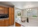 Bright kitchen area opening up to the dining area and views to the backyard at 9564 Cordova Dr, Highlands Ranch, CO 80130