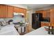 Well-maintained kitchen with stainless steel appliances and wooden cabinets at 9564 Cordova Dr, Highlands Ranch, CO 80130