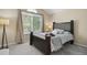 Serene main bedroom featuring a comfortable bed, large windows, and neutral tones for a relaxing atmosphere at 9564 Cordova Dr, Highlands Ranch, CO 80130