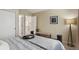 Comfortable main bedroom with a tray on the bed, a bench, and a soothing color scheme at 9564 Cordova Dr, Highlands Ranch, CO 80130