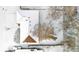 Aerial view of a snow-covered home, backyard, and shed at 2842 S Newport St, Denver, CO 80224