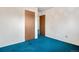 Bedroom featuring bright teal carpeting and access to ensuite at 2842 S Newport St, Denver, CO 80224