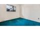 Bedroom with bright natural light from its large window and blue carpeting at 2842 S Newport St, Denver, CO 80224