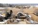 Aerial view of home featuring mature trees and a private driveway at 2451 S Fenton Dr, Lakewood, CO 80227