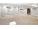 Spacious finished basement with carpet and natural light from large windows at 2451 S Fenton Dr, Lakewood, CO 80227