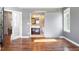 Bedroom with hardwood floors and a view of the ensuite bathroom through a sliding barn door at 2451 S Fenton Dr, Lakewood, CO 80227