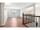 Bright living room with wood floors, white trim, and large windows for natural light at 2451 S Fenton Dr, Lakewood, CO 80227