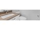 Bathroom showcasing a toilet, sink, and vanity combination with a clean, modern design at 1284 Tennyson St # 1, Denver, CO 80204