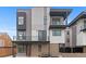 Contemporary three-story home showcasing modern design with balconies and a brick facade at 1284 Tennyson St # 1, Denver, CO 80204