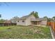 Spacious backyard featuring a well-maintained lawn, wood fence, and patio at 10441 Routt Ln, Broomfield, CO 80021