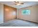 Bedroom featuring a large closet, window with backyard view, and neutral color palette at 10441 Routt Ln, Broomfield, CO 80021