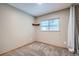 Empty bedroom featuring neutral walls, carpet, a window, and ceiling light at 10441 Routt Ln, Broomfield, CO 80021