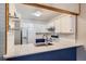 Well-appointed kitchen with white cabinets, stainless steel appliances, and stylish countertops at 10441 Routt Ln, Broomfield, CO 80021