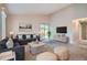 Bright living room with carpet flooring and lots of natural light from sliding glass doors at 10441 Routt Ln, Broomfield, CO 80021