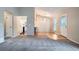 Cozy living room with open floor plan and view into a modern kitchen, perfect for entertaining at 10441 Routt Ln, Broomfield, CO 80021