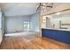 Open-concept living room flows into a modern kitchen with an island and sliding glass doors to outdoor space at 10441 Routt Ln, Broomfield, CO 80021