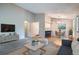 Spacious living room with vaulted ceilings, carpet flooring and a dining area at 10441 Routt Ln, Broomfield, CO 80021