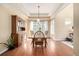 Bright dining room with hardwood floors and a built-in hutch at 8445 Braun Loop, Arvada, CO 80005