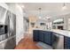 Kitchen with island, stainless steel appliances, and view to living room at 8445 Braun Loop, Arvada, CO 80005