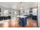 Modern kitchen with a large island, white and blue cabinets, and a breakfast nook at 8445 Braun Loop, Arvada, CO 80005