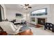 Bright and airy living room featuring a cozy fireplace and hardwood floors at 8445 Braun Loop, Arvada, CO 80005