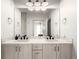 Bright bathroom with a double sink vanity, modern fixtures, and ample mirror space at 1941 Hooker St, Denver, CO 80204
