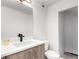 This bathroom features a floating vanity with a vessel sink and modern fixtures and cabinets at 1941 Hooker St, Denver, CO 80204