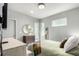 Bright bedroom with light walls, complementing the bed, TV, and natural light from the windows at 1941 Hooker St, Denver, CO 80204