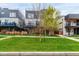 Charming modern home with a well-manicured lawn and inviting curb appeal, featuring fresh landscaping and a vibrant green lawn at 1941 Hooker St, Denver, CO 80204