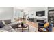 Inviting living room with a comfortable sofa, fireplace, dining area, and stylish decor, perfect for modern living at 1941 Hooker St, Denver, CO 80204