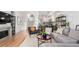 Spacious open-plan living area boasting modern amenities, including a sleek kitchen, comfortable lounge, and elegant hardwood flooring at 1941 Hooker St, Denver, CO 80204