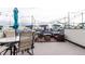 The rooftop deck has an outdoor dining and lounge area with umbrellas for comfortable outdoor living at 1941 Hooker St, Denver, CO 80204