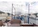 Enjoy stunning city views from the rooftop deck with stylish patio furniture and a bright atmosphere at 1941 Hooker St, Denver, CO 80204