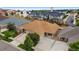 Aerial view of a home showcasing its brown roof, curb appeal, landscaping, and neighborhood at 4400 S Ensenada St, Aurora, CO 80015
