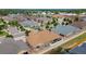 Areal view of a residential neighborhood showcasing the landscape and home with brown roof, backyard, and partial privacy fence at 4400 S Ensenada St, Aurora, CO 80015