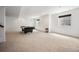 Finished basement with plush carpet and natural light showcasing a large billiards space at 4400 S Ensenada St, Aurora, CO 80015