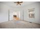 Bedroom with neutral carpet, ceiling fan, and bright window light at 4400 S Ensenada St, Aurora, CO 80015