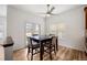 Cozy dining area featuring hardwood floors, neutral color palette and a modern ceiling fan at 4400 S Ensenada St, Aurora, CO 80015